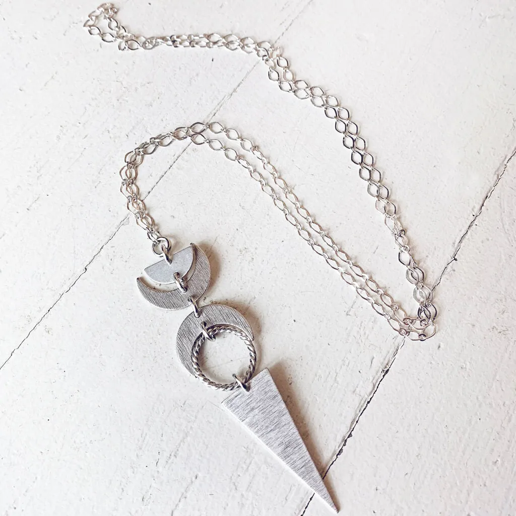 moon phases // half moon, waxing, waning crescent moons, new moon and long triangle pendant necklace