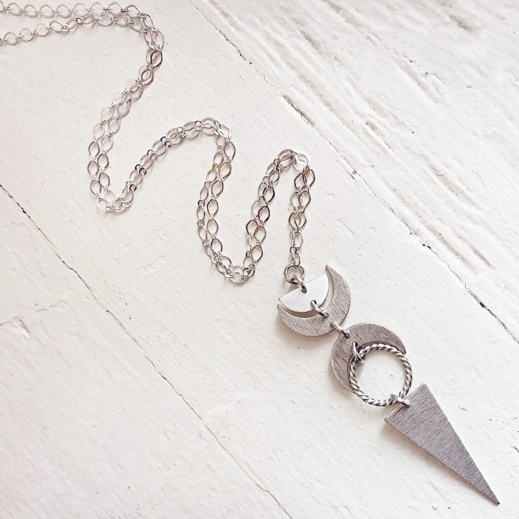 moon phases // half moon, waxing, waning crescent moons, new moon and long triangle pendant necklace