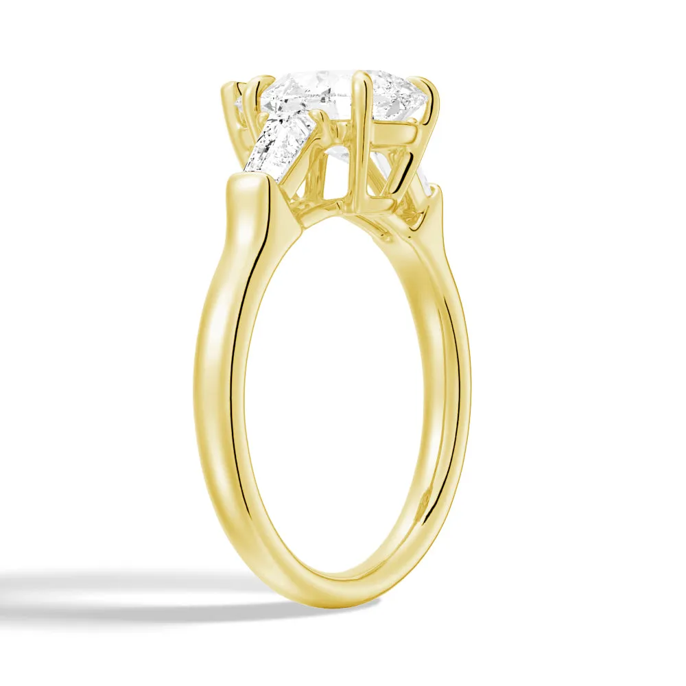 Pear Cut Engagement Ring with Tapered Baguette Stones